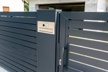 Modern styled house with a driveway, automatic sliding gates in Wollongong NSW.